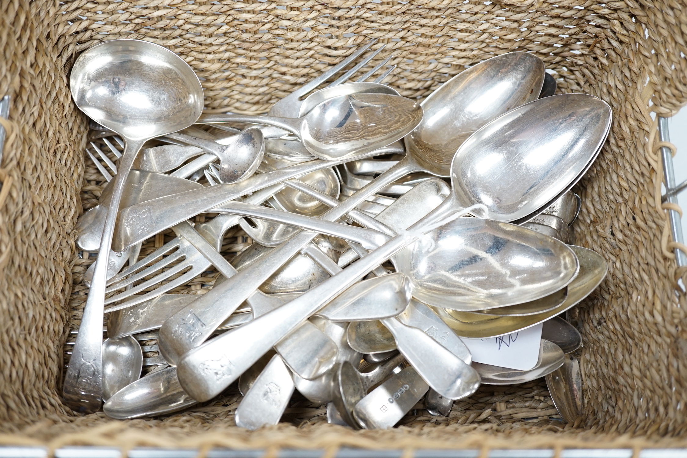 A collection of George III and later silver flatware including a sauce ladle, six Old English pattern tablespoons and a fiddle pattern tablespoon, nine dessert forks, six dessert spoons and twenty seven tea, coffee and s